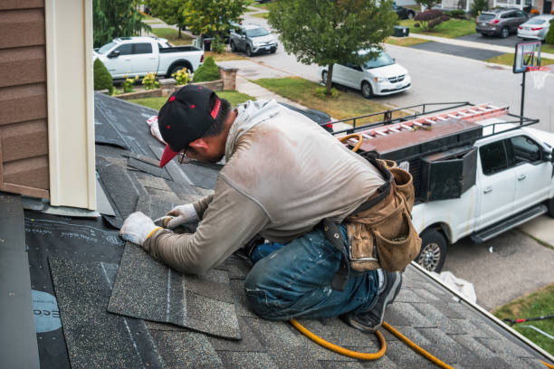 Professional Roofing technician working in Sand Lake, MI